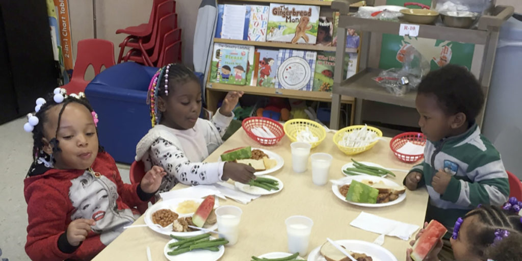Children eating lunch provided by Alta Head Start